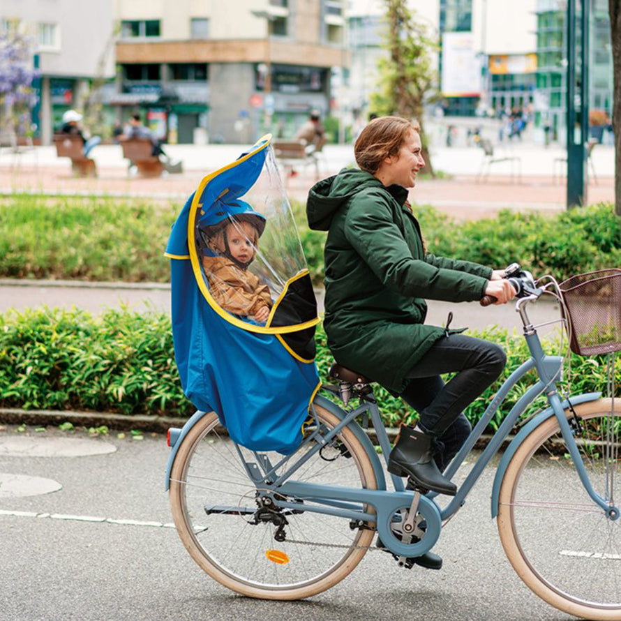 Le pare brise vélo : avantages de la protection pluie pour siège